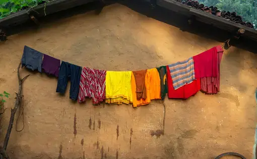 Clothes drying outside a house in the Bastar district. Image by Amitrane / Shutterstock. India, 2016.
