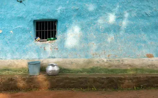 Water utensils are kept outside of a house in the Bastar district in central India. Image by Amitrane / Shutterstock. India, 2016.