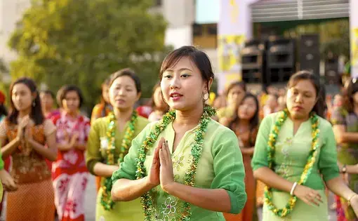 Burmese women perform traditional dance during closing ceremony of Myanmar New Year Water Festival 2011 in Yangon, Myanmar. Image by Htoo Tay Zar. Myanmar, 2011.