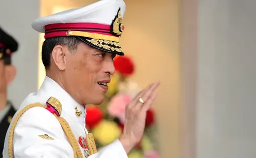 Thai King Maha Vajiralongkorn gestures to people in Bangkok. Image by Shutterstock. Thailand, 2010.