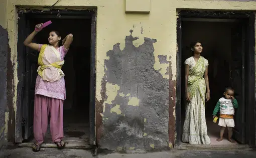 Teenage girls outside Tarash Mandir, a short-stay home for young women and permanent facility for elderly widows in Vrindavan, India.