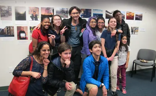 Hardy Middle School students visiting the Pulitzer Center pose with their photography from the "Walk Like a Journalist" workshop. Image by Perrine Punwani. Washington, D.C., 2017.