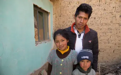 Victor Corhuari has been searching for his sister, Zulma, who was 16 when she went missing in April 2017. He is a single father and lives with his daughter Deysi, his son Neymar, and his sister's child, not shown. Image by Tracey Eaton. Bolivia, 2017.