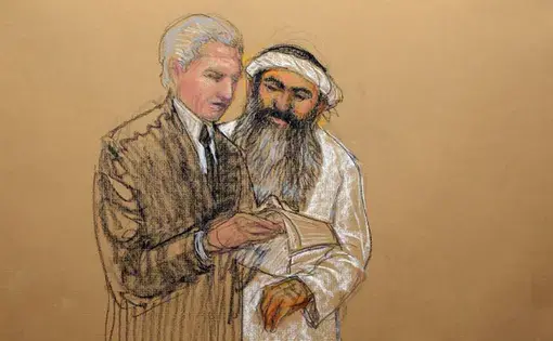In this sketch by courtroom artist Janet Hamlin and reviewed by the U.S. Department of Defense, Khalid Sheik Mohammed, right, consults with his civilian attorney David Nevin during a break of his military hearing at the U.S. Navy base at Guantanamo Bay. Image by Janet Hamlin. Cuba, 2012.