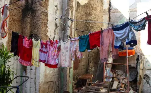 Clothes hang at the San Ignacio Street shelter in Havana. Image by Katherine Lewin. Cuba, 2019.