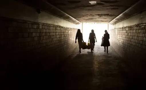 Au pairs walk back to the train after shopping at Loppemarked, a weekend flea market in Gentofte, a wealthy suburb of Copenhagen. The women buy second-hand clothing and gifts to send to their families back home, a common practice of overseas Filipino workers. Image by Allison Shelley. Denmark, 2016.