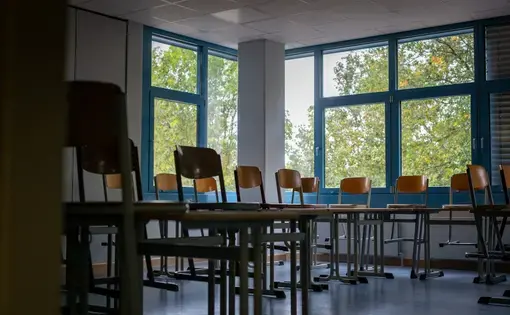 An empty classroom at a high school in Bruhl, Germany. Schools across the country are closed again despite early success in getting children back into classrooms during the pandemic. Image by Ryan Delaney. Germany, undated.