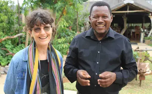 In the field: Journalist Michelle Nel (left) with Pastor Solly Mhaule, a community elder who believes the Public Protector needs to investigate the MalaMala land deal. Image by Dennis Scully. South Africa, 2019.