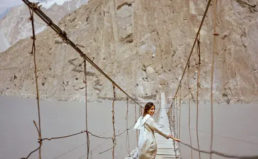 British visitor Subeera Hussain walks along a hanging bridge near Passu, a town in the Hunza valley of northern Pakistan. She wishes more people knew about the country’s beauty. “Tell people about Pakistan, the real Pakistan” she says. “I’m traveling alone as a woman and I’ve never felt more safe.” Image by Sara Hylton/National Geographic. Pakistan, 2019.