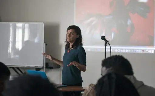 Pulitzer Center grantee Allison Shelley speaks to Soul of the City students at Richard Wright Public Charter School about photojournalism and her work in Haiti. Image by Jordan Roth. United States, 2016.