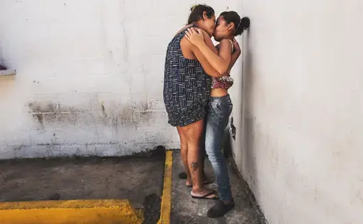 POLI-VALENCIA, CARABOBO - March 2018. Maria (on the left) kisses her daughter on visitation hours. She is 35 years old and is charged with robbery. She goes to therapy three times a week. While the beginning of the trials keep on being delayed, the condition of these women inside this precinct in the center of Valencia, a city on north-center of the country, has improved slightly between 2017 and 2018. They are now permitted to have a cellphone, hairdressing utensils and a 3hour recreation time outside…