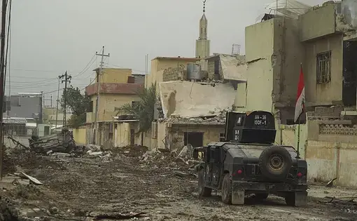 ISOF APC on the street of Mosul. Image by Mstyslav Chernov/Wikimedia Commons. Iraq, 2016.