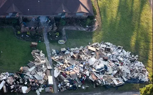 Hurricane Harvey flooded and ruined every home in some Texas neighborhoods, such as this one in the city of Vidor, in eastern Texas. Image by Alex MacLean. United States, 2017.
