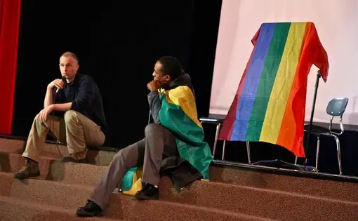 Micah Fink, left, and Maurice Tomlinson discuss "The Abominable Crime" with students at The Arts Academy at Benjamin Rush. Image by Amanda Ottaway. Philadelphia, 2014. Media file: img_2934_0.jpg