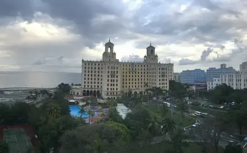 Three aspects of Havana's skyline meet on a cloudy day: the Malecón, Vedado, and Havana Vieja. Image by Esohe Osabuohien. Cuba, 2018. Three aspects of Havana's skyline meet on a cloudy day: the Malecón, Vedado, and Havana Vieja. Image by Esohe Osabuohien. Cuba, 2018.