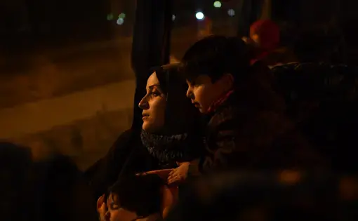 Taimaa, a young Syrian mother of two, takes the overnight bus from Thessaloniki to Athens to find out which European country has decided to accept her claim for asylum. It is a time fraught with uncertainty. Will she get Germany? France? Or a country she has never heard of? Image by Lynsey Addario. Greece, 2017.