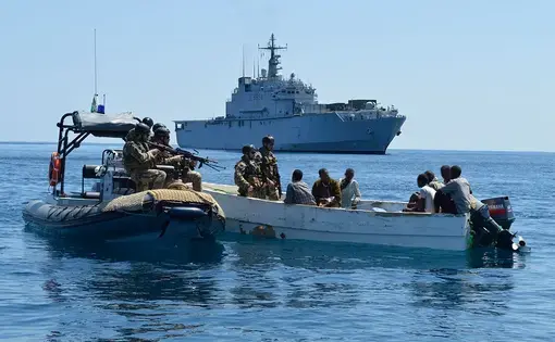 Capturing suspected pirates off the coast of Somalia. Image courtesy of the European Union Naval Force. Somalia, 2012.