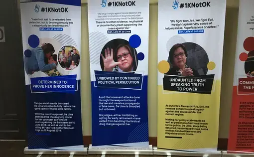 Posters of opposition politician Leila de Lima outside her office in the Philippine Senate.  De Lima, a sharp critic of Filipino president Rodrigo Duterte, has been in prison for more than three years on what legal experts, human rights organizations, and fellow opposition politicians believe to be trumped up charges of drug trafficking. Image by Richard Bernstein. Philippines, 2019.