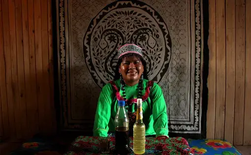 Karina Garcia Rios, the only female shaman in her community 15 hours from the nearest city of Pucallpa says harvesting female power is what makes her an effective doctor. Image by Natalie Hutchison. Peru, 2017.