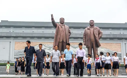 Locals in Pyongyang. Image by LMspencer / Shutterstock.com. North Korea, 2016.
