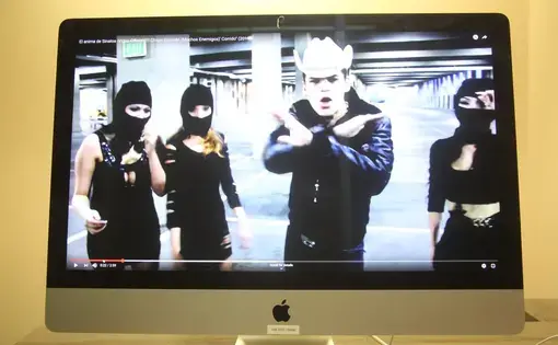 This music video, viewed more than 2.5 million times on YouTube, celebrates convicted cartel kingpin Joaquín "El Chapo" Guzmán. Image by Omar Ornelas/The Desert Sun. Mexico, 2019.
