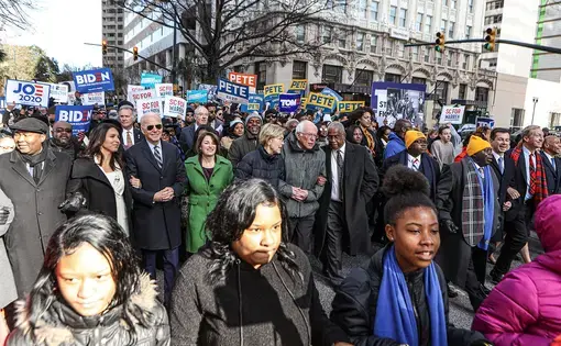 Democratic candidates for president march at King Day at The Dome Rally in Columbia, South Carolina a month before the "First in the South" primary election. Image by Perry McLeod / Shutterstock. United States, 2020.