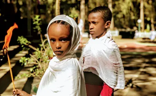 A young Orthodox Christian girl outside of St. Mary Entoto in Addis Ababa, Ethiopia. Image by Arianne Lachapelle Henry. Ethiopia, 2019. A young Orthodox Christian girl outside of St. Mary Entoto in Addis Ababa, Ethiopia. Image by Arianne Lachapelle Henry. Ethiopia, 2019.