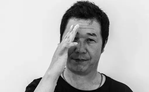 Zhang Yong Cheng, a 47 year-old butcher from China, shows his finger that was cut with a blade. His employer misreported this case when he was injured at work, and he was also underpaid, he said. Image by Xyza Bacani. Singapore, 2017.