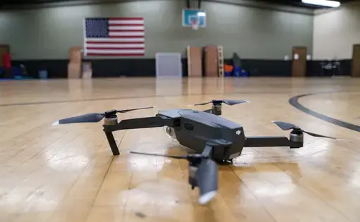 A Jeffersontown Police officer demonstrates flying the department’s DJI Mavic Pro drone in the police department gym. Image by J. Tyler Franklin. USA, 2019.