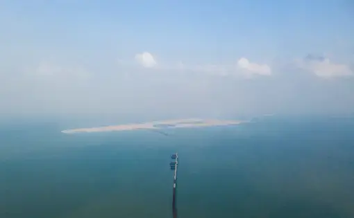 Ruyi island, off Haikou city, was intended as a tourist destination, with theme parks and hotels. Its planned size is over 7 square kilometres and it is to be linked to the mainland through a 5.6 km bridge. In an inspection by the authorities in 2017, the project was found to have reclaimed 210,000 sqm of the sea without proper permits. The land reclamation there which started in 2015 has been stopped because of both the environmental inspection as well as the developer running short of funds. In July 2018…