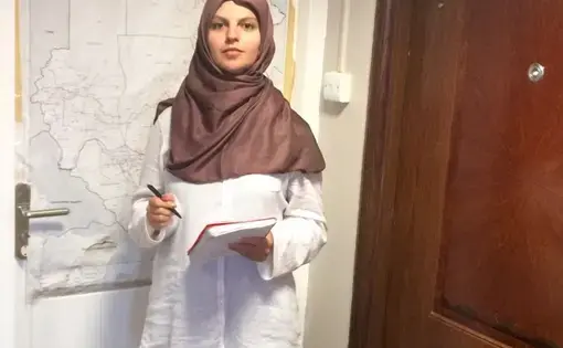 Reporter Kira Zalan preparing for an interview at the Islamic Fiqh Council in Khartoum.
