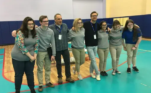 Jon Cohen and Carl Gierstorfer pose with students at Gateway Science Academy in St. Louis.