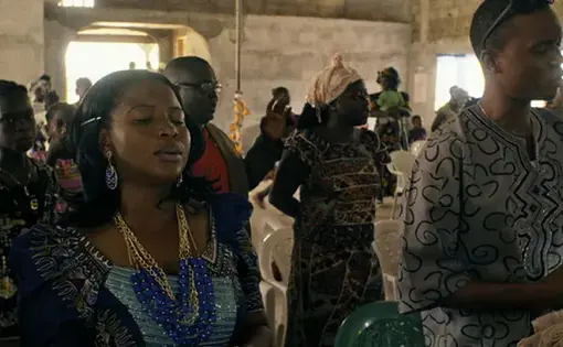Every Sunday, Mabel Musa attends church praying for her patients to stop dying from Ebola. Image by DOCDAYS Productions/Carl Gierstorfer. Liberia, 2015.