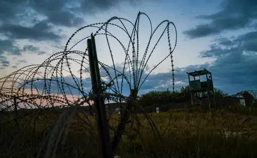 Mohammed al-Qahtani was brutally interrogated by the U.S. military at Camp X-Ray, above, a detention facility at Guantánamo Bay. Image by Doug Mills/The New York Times. Cuba, 2020.