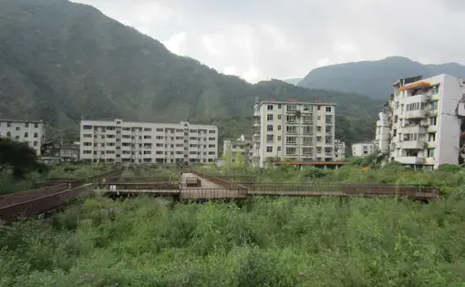 This ghost town sits just 10 miles away from this new town where the survivors are trying to move forward after the devistating earthquake hit in 2008. Image by Daniel Brook. China, 2017.