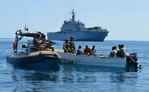 Capturing suspected pirates off the coast of Somalia. Image courtesy of the European Union Naval Force. Somalia, 2012.