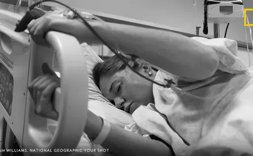 12 hours into an eventual 17-hour childbirth, my girlfriend was definitely feeling the pain. I looked on helplessly as nothing compared to the moments of pain and the respite between. Gas, drugs, and a hand to hold only had so much effect. This day I found out how truly strong she is… Image by Sam Williams, National Geographic Your Shot.