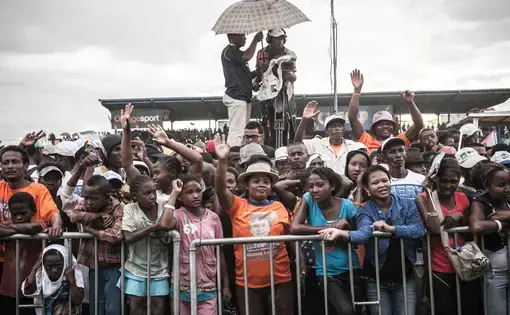 Supporters of presidential candidate Hery Rajaonarimampianina at a rally in the capital, Antananarivo, in December. Rajaonarimampianina was sworn into office on Jan. 25, ending a five-year political crisis sparked by a 2009 coup. Image by Rijasolo / Riva Press. Madagascar, 2013. Media file: hery_pic.jpg