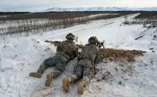 U.S. Army troops practice defensive tactics at Fort Greely, Alaska. The fort is a launch site for interceptor missiles that are designed to shoot down incoming ballistic missiles—like those North Korea has said it now possesses. Image by Louie Palu. United States, 2018.
