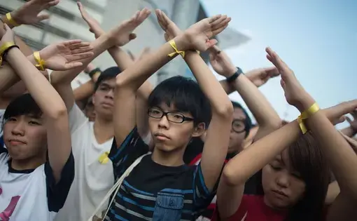 Joshua Wong (center) leading pro-democracy protests in Hong Kong. Image by Anthony Kwan/Getty Images. China, 2014.
