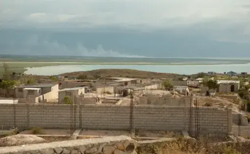 A view from the hilltop Village de Pecheur neighborhood of greater Canaan. Image by Allison Shelley. Haiti, 2019.