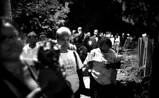 Family members grieve over the body of a family member at the scene of a double homicide in Guatemala City. The murders occurred during the wake for another murder victim. According to the National Civilian Police (PNC) of Guatemala, there were 5,682 registered deaths in 2007 and 6,200 in 2008 making Guatemala one of the most violent countries in the world. Image by Carlos Javier Ortiz. Guatemala, 2013. A hug. Image by Carlos Javier Ortiz. Guatemala, 2013.