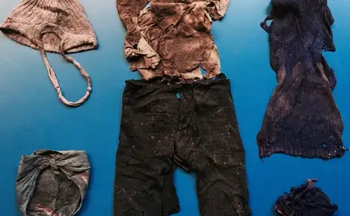 Remnants of clothing found in a mass grave at a military base in Guatemala's Alta Verapaz region. Image by Jason Motlagh. Guatemala, 2017.