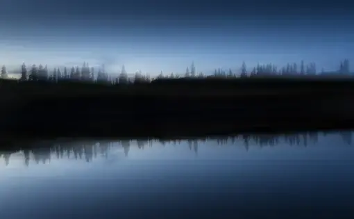 The Attawapiskat river at dusk. The river is a central part of cultural life for the Cree of Attawapiskat, having provided them with food, transportation and recreation for generations. The word Attawapiskat translates to “People of the Parting Rocks,” in reference to a distinct rock formation found several kilometres up river. Image by David Maurice Smith. Canada, 2016.