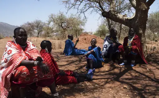  Orendeke village. Maasai women activists meeting and discussing further proceedings. They were tricked by an official out of a deed they had on land, loosing 2/3 of the surface. A NGO built milk center is now in the middle of a developping area and can not be used. They are planning on taking the case to court. Image by Thomas Dworzak. Tanzania, 2018.