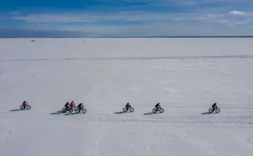 The fat tire bike race across the frozen surface of Lake Superior on Chequamegon Bay in Washburn, Wisconsin, takes place on Feb. 16, 2020. The 20K race is one of Wisconsin's most unique fat bike races, bringing about 100 participants. Image by Zbigniew Bzdak/The Chicago Tribune. United States, 2020.