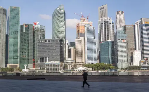 Marina Bay, Singapore - Singapore Business District goes empty and quiet during partial lockdown due to coronavirus. Image by Wisnu Haryo Yudhanto / Shutterstock. Singapore, 2020.
