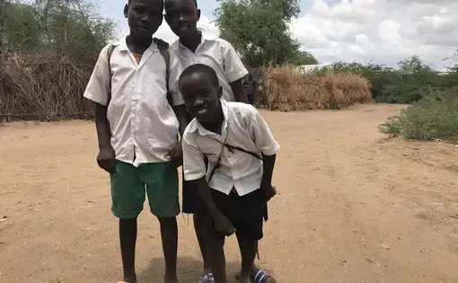 Kids at Kakuma refugee camp walk home from school. Image by Jaime Joyce. Kenya, 2018.