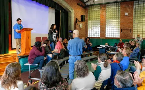 Letcher County, Ky. delegation gives a presentation to Leverett, Mass. audience. Image by Greenfield Recorder. United States, 2017.
