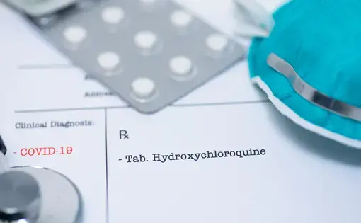 Doctor prescribing hydroxychloroquine for the treatment of novel coronavirus COVID-19. Image by Manjurul Haque / Shutterstock.